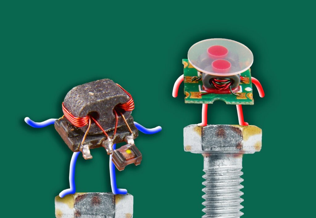 anthropomorphized-miniature-gadgets-standing-on-the-heads-of-two-hex-bolts – Robótica, Inteligencia Artificial, Automatización